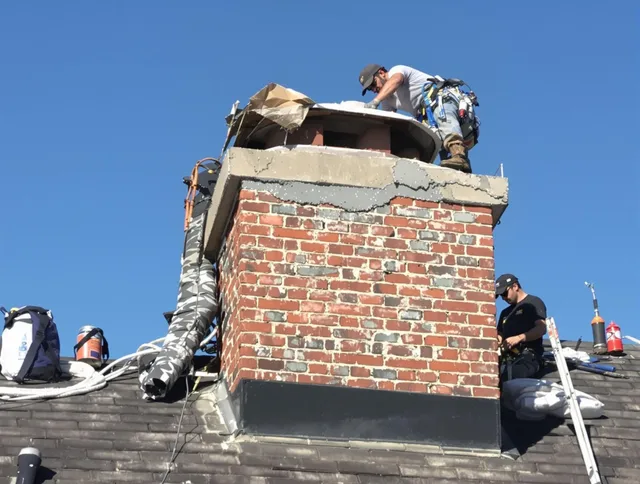 Somerset Chimney Sweep installing a custom chimney crown in Somerset, MA