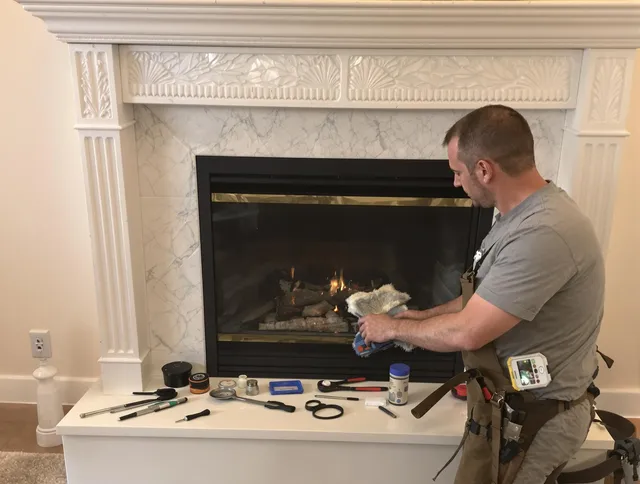 Somerset Chimney Sweep performing fireplace maintenance in Somerset, MA