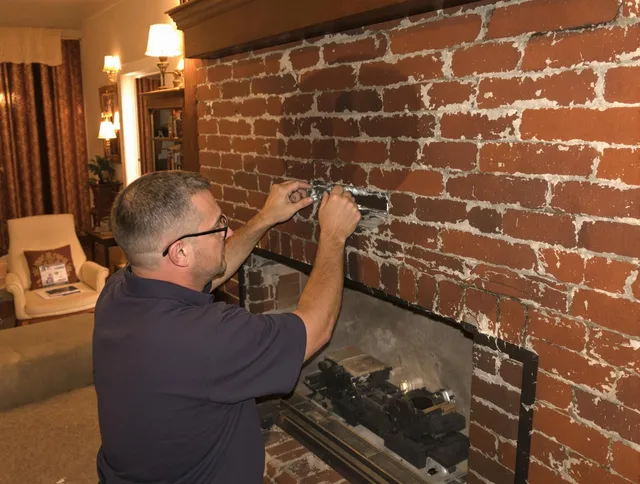 Somerset Chimney Sweep expert fixing a fireplace in Somerset, MA